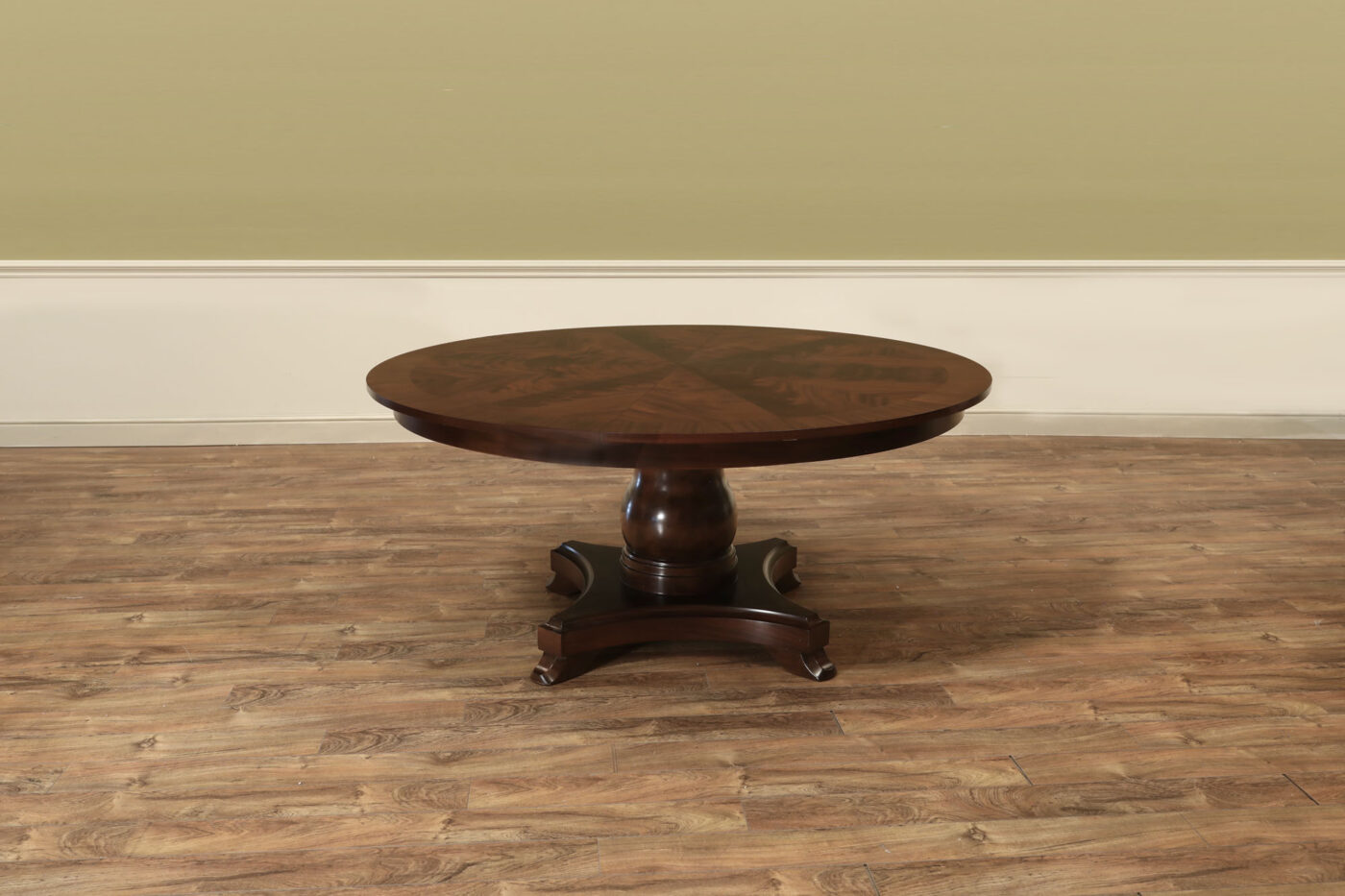 Mahogany Jupe table.  64 inch round to round solid dining table with brown mahogany finish. Leaves are self storing and fold out to make a larger 84 inch round dining table. - Image 2