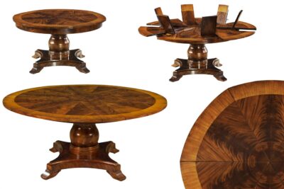 Round mahogany dining table with self storing leaves