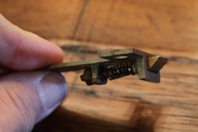 Spring loaded lock holds leaves in place when table is open