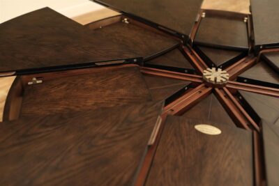 Table shown with leaves inside tabletop