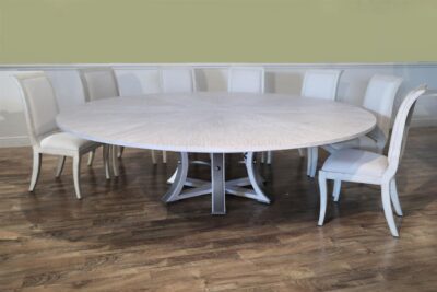 Large Round Expanding Jupe table for seating 8 to 12 people, white pigmented oak finish