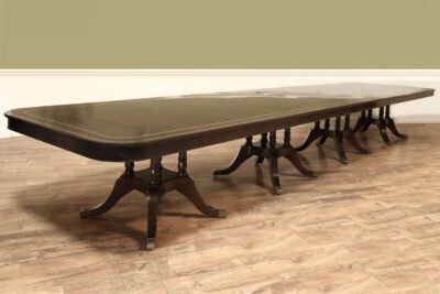 Custom 20 foot mahogany dining room table, a 2-piece tabletop and four pedestals