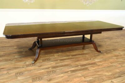 This dining table was designed to be used with with leaf most the time and two leaves stowed away.