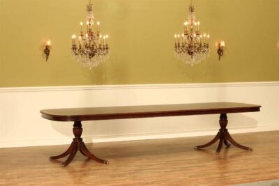 Large mahogany dining table with 3 leaves easily seats 12 to 14 people