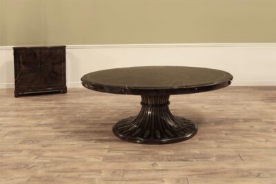 Modern round extendable dinig table shown with no leaves, seats 6 people