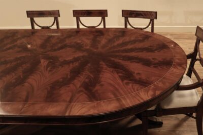 Round flame mahogany dining table