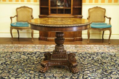 Brass accented 42 inch round center table for the higher end home