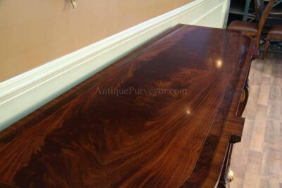 Top of cabinet has bookmatched crotch mahogany and inlay