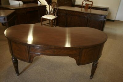 Mahogany kidney desk in low light