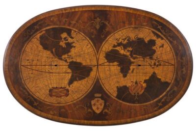 Top of desk has wood inlay of the world map