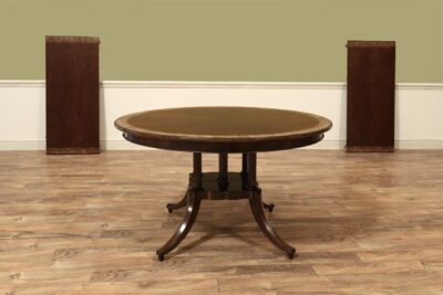 Traditional 54-Inch Round Walnut Pedestal Table with Leaves for a Formal Dining Room