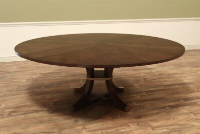 Expandable large Jupe table with transitional saber legs, cherry tabletop and brass accented feet