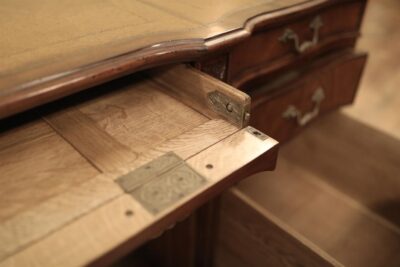 The front of the pencil drawer opens when you press two small brass button and reveals keyboard area