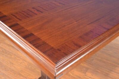 High end mahogany conference table with straight grain mahogany banding. Expands from 81-140.