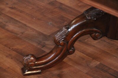 Close up of the leg on the pedestal of the French Style mahogany dining table