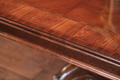 Close up of the mahogany apron, reeded edge and blonde banding on the French Style dinging table