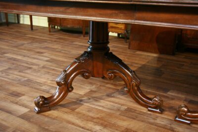 Close up of a pedestal on this double pedestal mahogany dining table